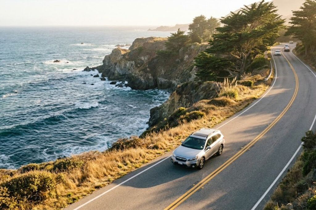 Standard SUV driving along the California coast